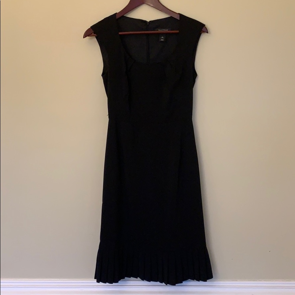 Black over the dress with feminine details
